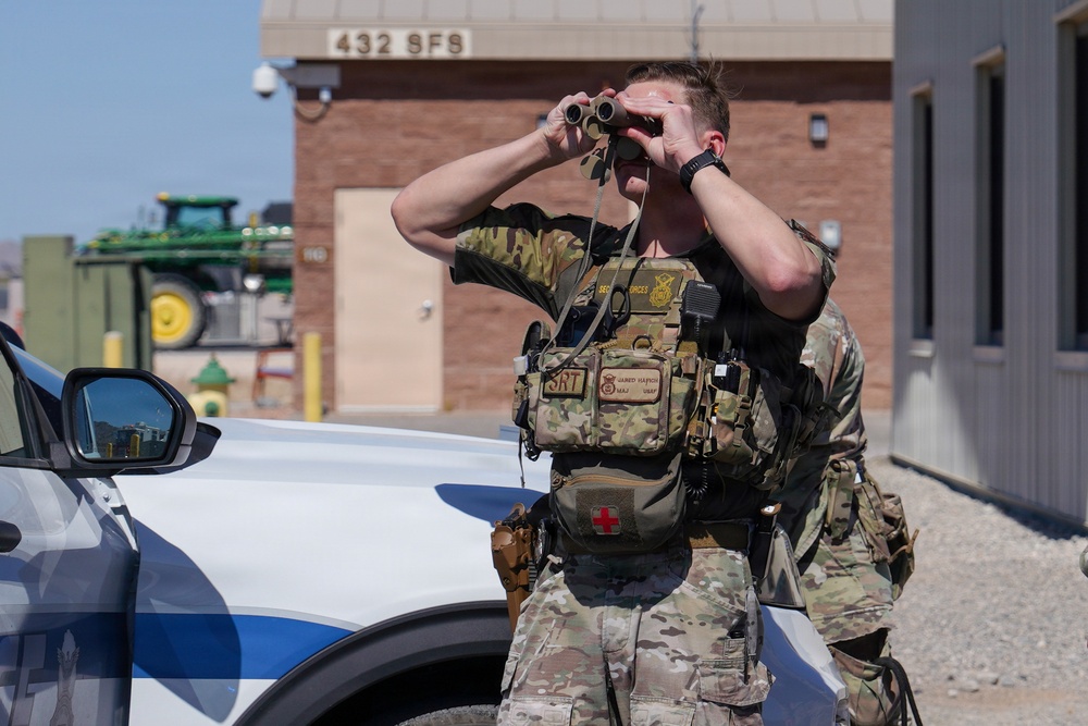 Combat readiness inspection integrates simulated threats; 432nd Wing Airmen respond