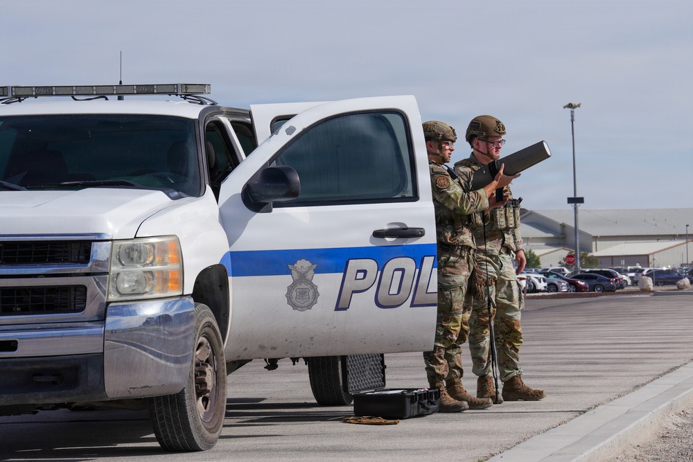 Combat readiness inspection integrates simulated threats; 432nd Wing Airmen respond