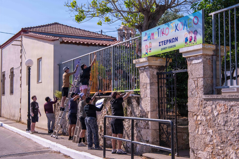 NSA Souda Bay Sailors paint a local elementary school