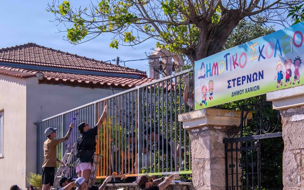 NSA Souda Bay Sailors paint a local elementary school