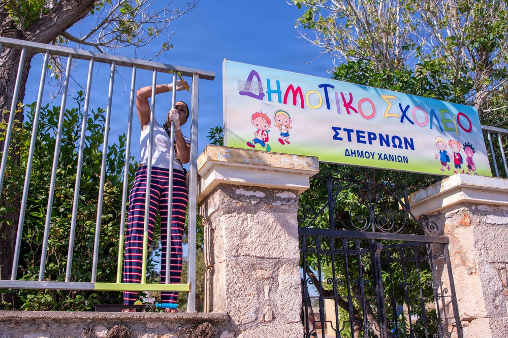NSA Souda Bay Sailors paint a local elementary school