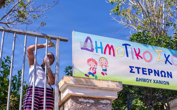 NSA Souda Bay Sailors paint a local elementary school
