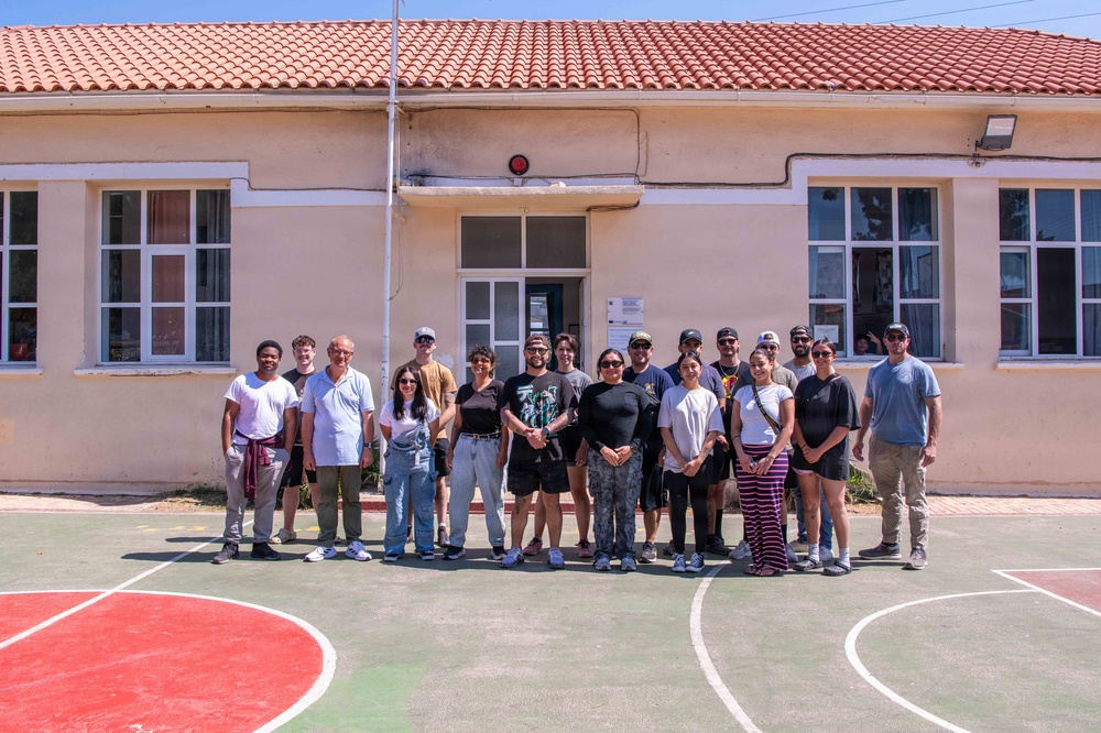 NSA Souda Bay Sailors paint a local elementary school