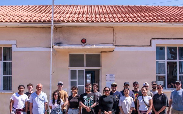 NSA Souda Bay Sailors paint a local elementary school