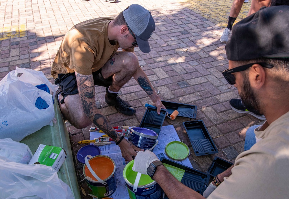 NSA Souda Bay Sailors paint a local elementary school