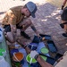 NSA Souda Bay Sailors paint a local elementary school
