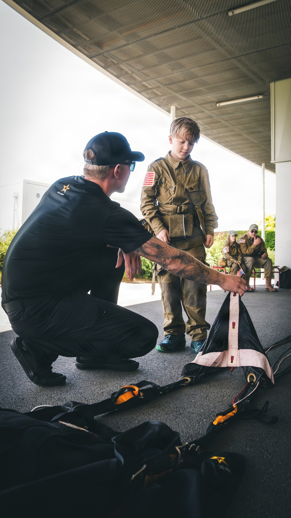 Paratroopers conduct parachute demonstration for French school at D-Day 82