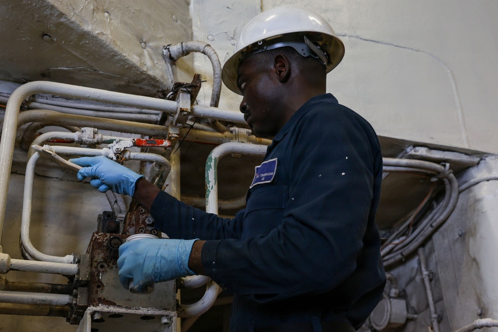 USS Iwo Jima Sailor Maintains Pipes