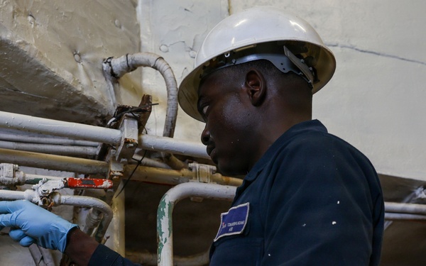 USS Iwo Jima Sailor Maintains Pipes