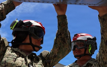 HSM-37 Sailors conduct helo maintenance