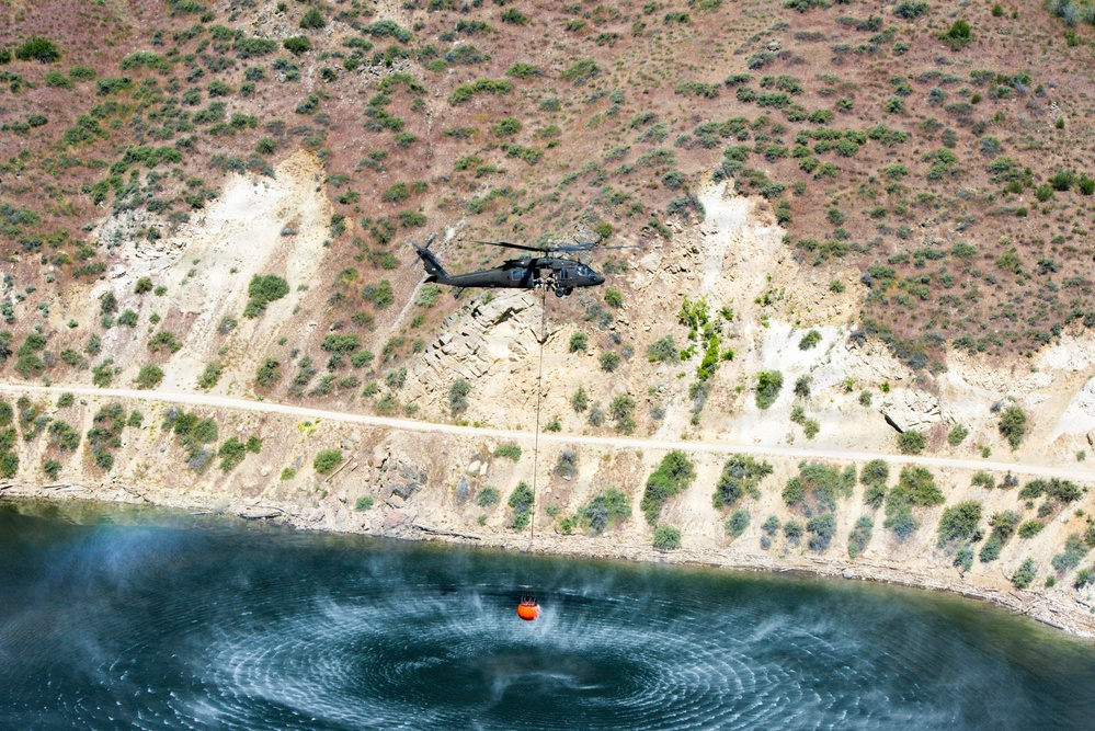 Idaho Army National Guard UH-60M Black Hawk helicopter crew conducts water bucket training.