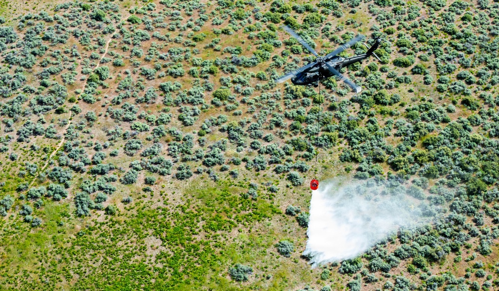 Idaho Army National Guard UH-60M Black Hawk helicopter crew conducts water bucket training.