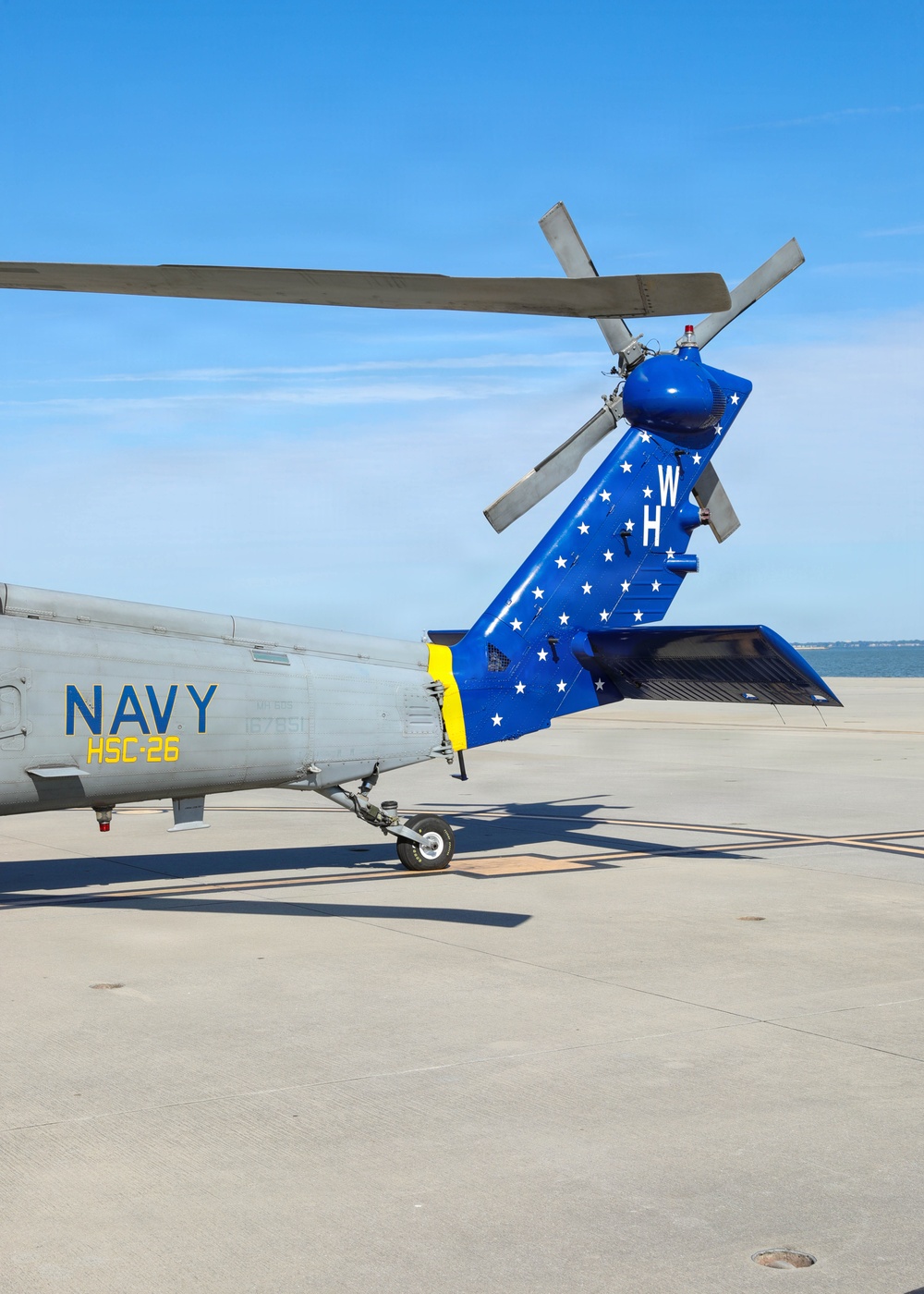 HSC-26 finish painting the tail of their MH-60S Seahawk helicopter