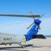 HSC-26 finish painting the tail of their MH-60S Seahawk helicopter