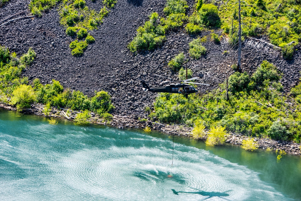 Idaho Army National Guard UH-60M Black Hawk helicopter crew conducts water bucket training.