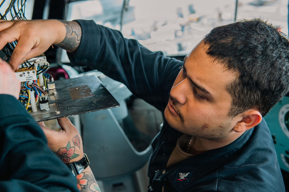 Ronald Reagan Sailors Conduct Maintenance On Heater Wiring