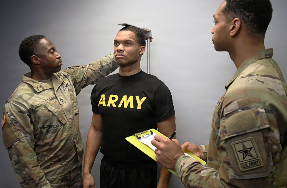 U.S. Army soldiers conduct physical fitness assessment height measurement