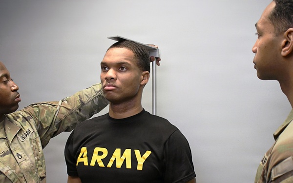 U.S. Army soldiers conduct physical fitness assessment height measurement