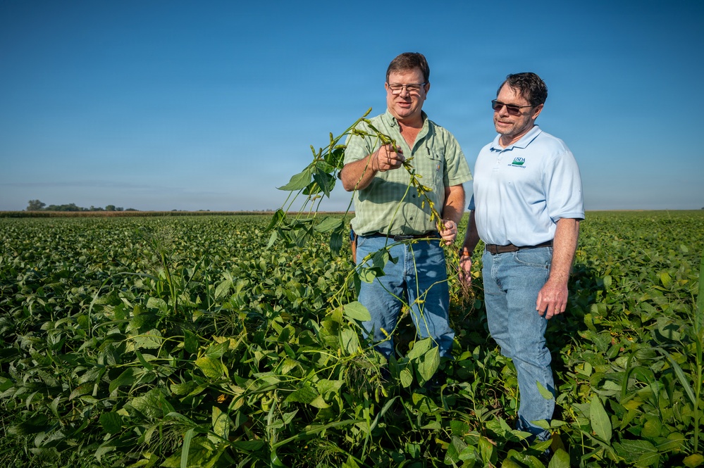 Soybean farmer with RMA employee