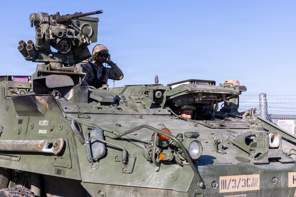 Soldier drive a Stryker