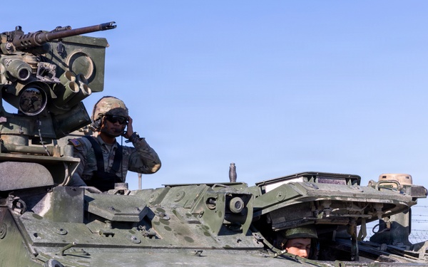 Soldier drive a Stryker