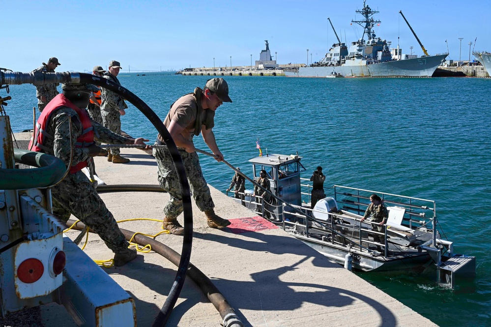 Spanish Armada and U.S. Navy personnel participate in a bilateral oil spill response exercise
