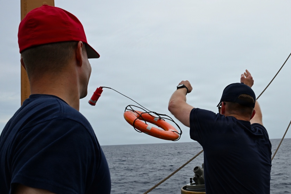Coast Guard Cutter Eagle crew members conduct man-overboard drills