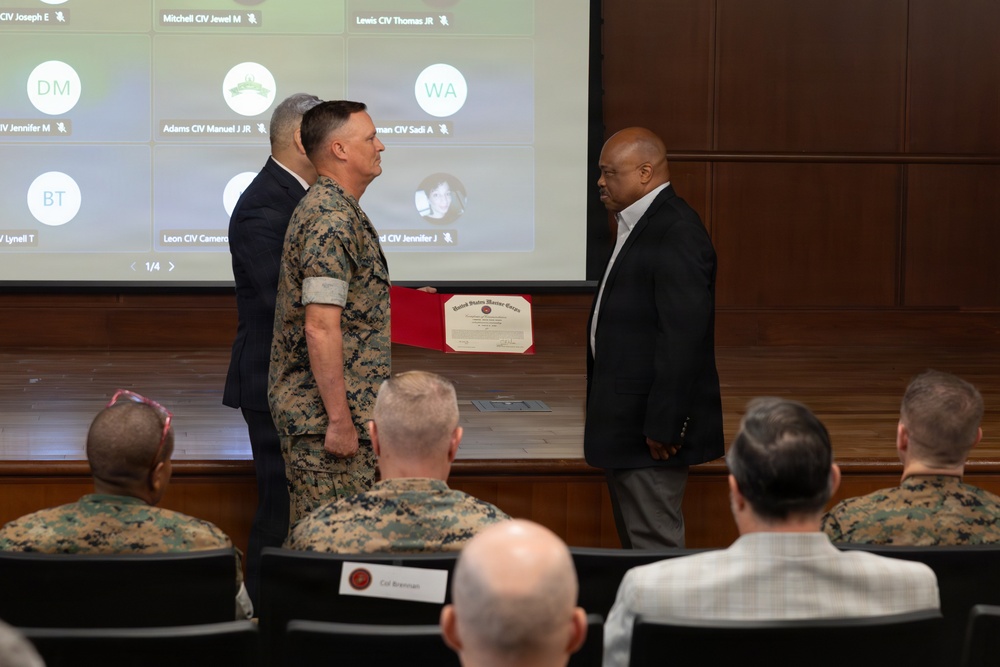 Lt. Gen. Leonard F. Anderson IV presents awards to civilians with Marine Corps Support Facility New Orleans