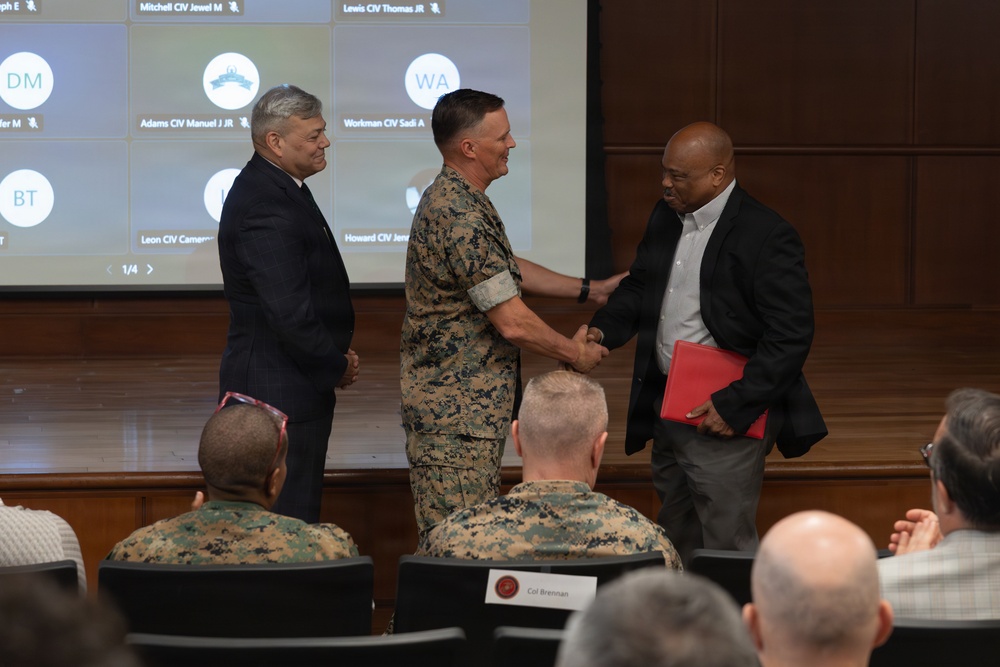 Lt. Gen. Leonard F. Anderson IV presents awards to civilians with Marine Corps Support Facility New Orleans