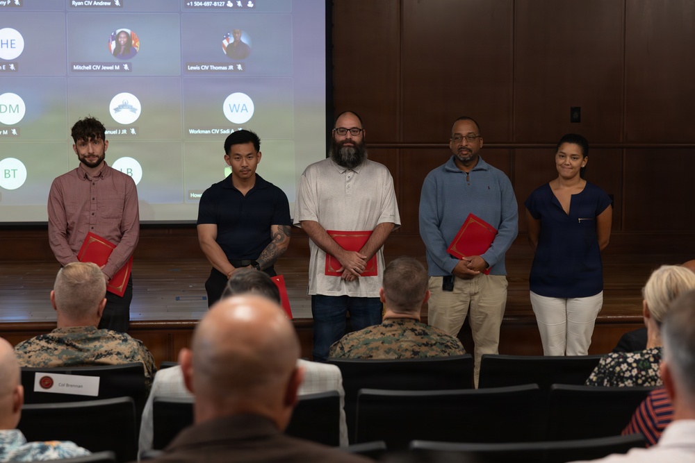 Lt. Gen. Leonard F. Anderson IV presents awards to civilians with Marine Corps Support Facility New Orleans
