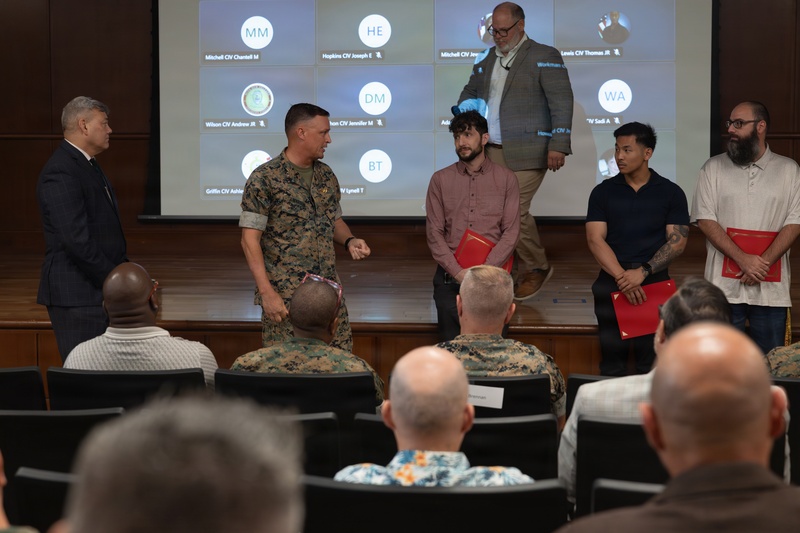Lt. Gen. Leonard F. Anderson IV presents awards to civilians with Marine Corps Support Facility New Orleans