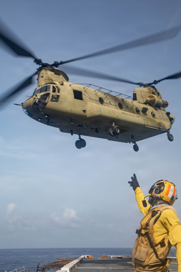 A U.S. Sailor with San Antonio-class amphibious transport dock USS Fort Lauderdale (LPD 28) gives a sendoff salute to a U.S. Army CH-47 Chinook assigned to Joint Task Force-Bravo, during deck landing qualifications while underway in the Caribbean Sea, June 4, 2026. U.S. military forces are deployed to the U.S. Southern Command area of responsibility in support of Operation SOUTHERN SPEAR, Department of War-directed operations, and the president’s priorities to disrupt illicit drug trafficking, deter malign actors and protect the homeland through continuous presence. (U.S. Marine Corps photo)
