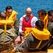 Travis Airmen complete water survival training at Lake Berryessa