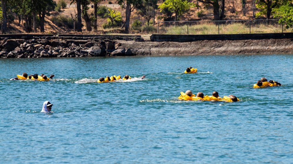 Travis Airmen complete water survival training at Lake Berryessa
