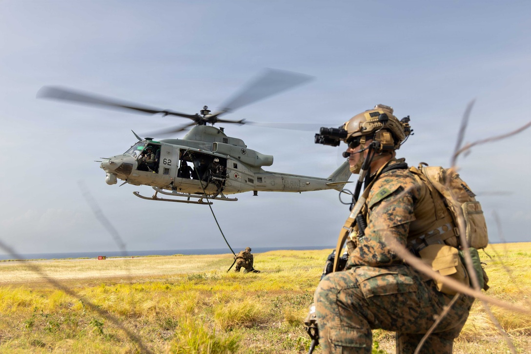 A U.S. Marine with Lima Company, 3rd Battalion, 2nd Marine Regiment, Littoral Combat Force-24, posts security during a long range fast-rope rehearsal from a UH-1Y Venom with Marine Medium Tiltrotor Squadron (VMM) 365 (Reinforced), LCF-24, at Naval Station Guantanamo Bay, Cuba, June 4, 2026. U.S. military forces are deployed to the U.S. Southern Command area of responsibility in support of Operation SOUTHERN SPEAR, Department of War-directed operations, and the president’s priorities to disrupt illicit drug trafficking, deter malign actors and protect the homeland through continuous presence. (U.S. Marine Corps photo)