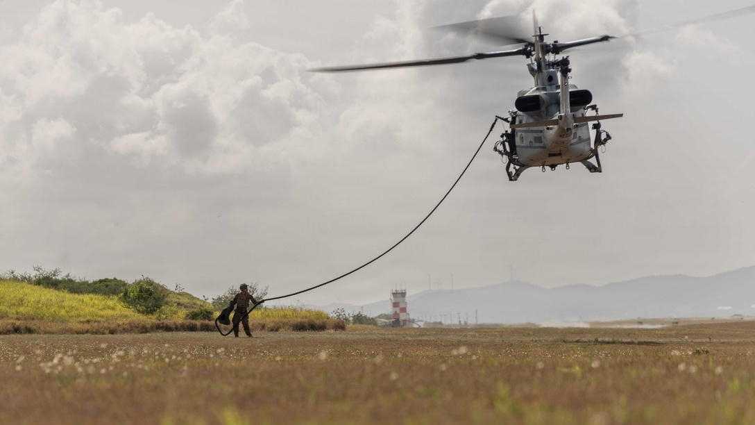 A U.S. Marine with Lima Company, 3rd Battalion, 2nd Marine Regiment, Littoral Combat Force-24, grabs the fast-rope during a long range fast-rope rehearsal from a UH-1Y Venom with Marine Medium Tiltrotor Squadron (VMM) 365 (Reinforced), LCF-24, at Naval Station Guantanamo Bay, Cuba, June 4, 2026. U.S. military forces are deployed to the U.S. Southern Command area of responsibility in support of Operation SOUTHERN SPEAR, Department of War-directed operations, and the president’s priorities to disrupt illicit drug trafficking, deter malign actors and protect the homeland through continuous presence. (U.S. Marine Corps photo)