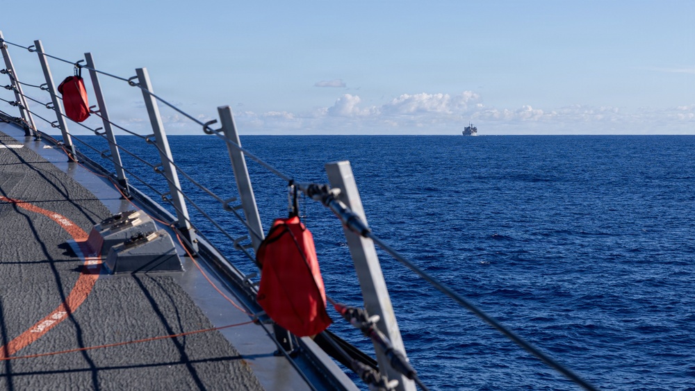 USS Mustin conducts a replenishment-at-sea with USNS Arctic