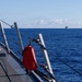 USS Mustin conducts a replenishment-at-sea with USNS Arctic