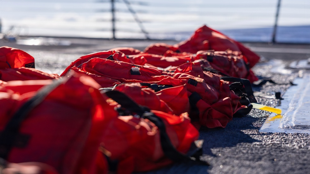 USS Mustin conducts a replenishment-at-sea with USNS Arctic