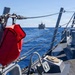 USS Mustin conducts a replenishment-at-sea with USNS Arctic