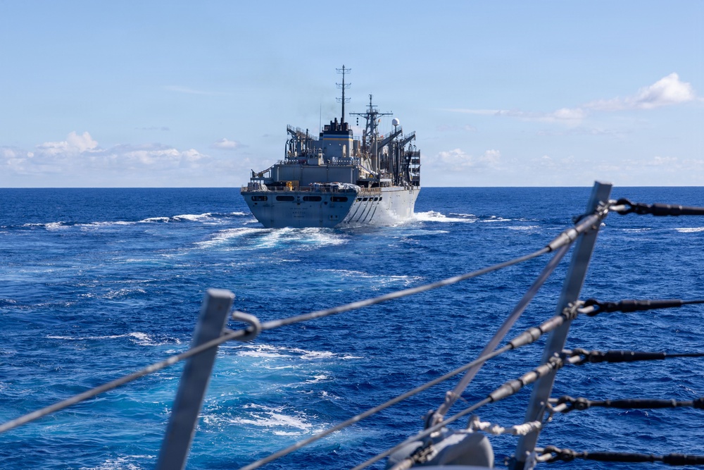 USS Mustin conducts a replenishment-at-sea with USNS Arctic