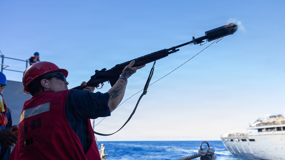 USS Mustin conducts a replenishment-at-sea with USNS Arctic