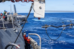 USS Mustin conducts a replenishment-at-sea with USNS Arctic [Image 11 of 15]