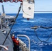 USS Mustin conducts a replenishment-at-sea with USNS Arctic