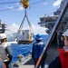 USS Mustin conducts a replenishment-at-sea with USNS Arctic