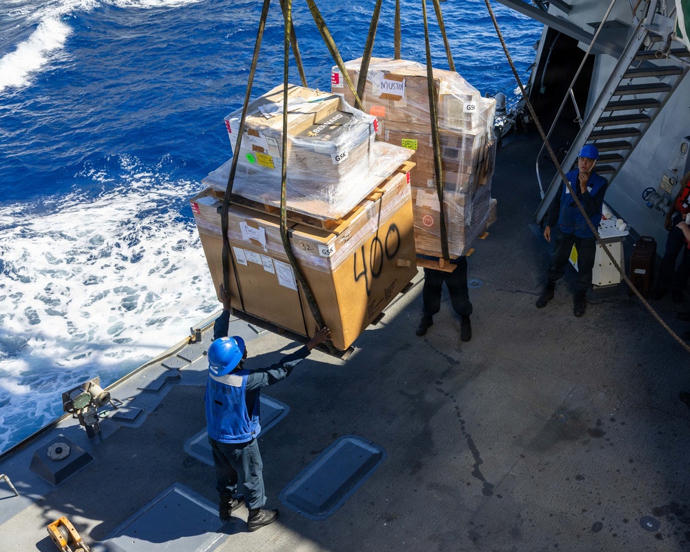 USS Mustin conducts a replenishment-at-sea with USNS Arctic