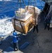 USS Mustin conducts a replenishment-at-sea with USNS Arctic