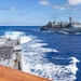 USS Mustin conducts a replenishment-at-sea with USNS Arctic