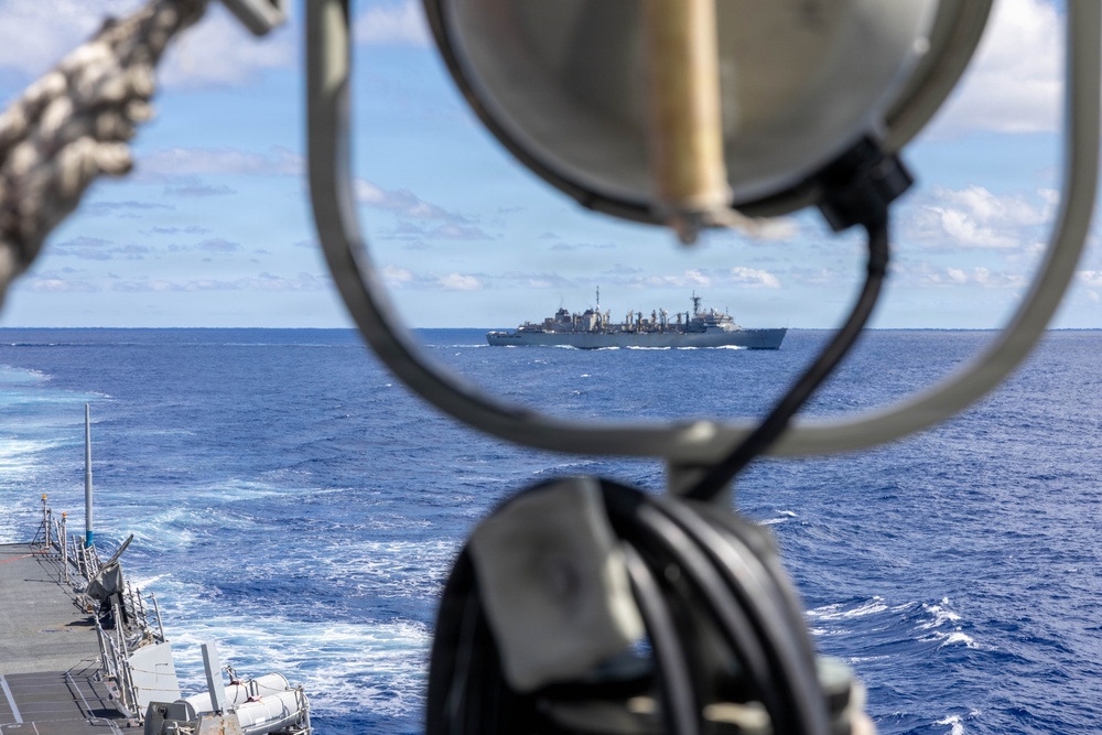 USS Mustin conducts a replenishment-at-sea with USNS Arctic
