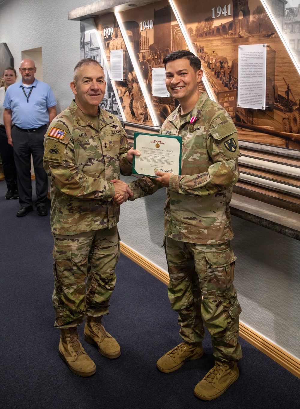 Captain Eric Inman receives a Meritorious Service Medal